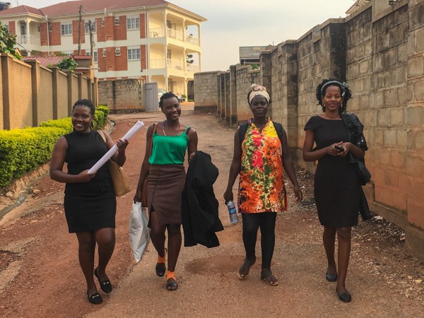 SPOON's four Master Trainers in Uganda walking down the street