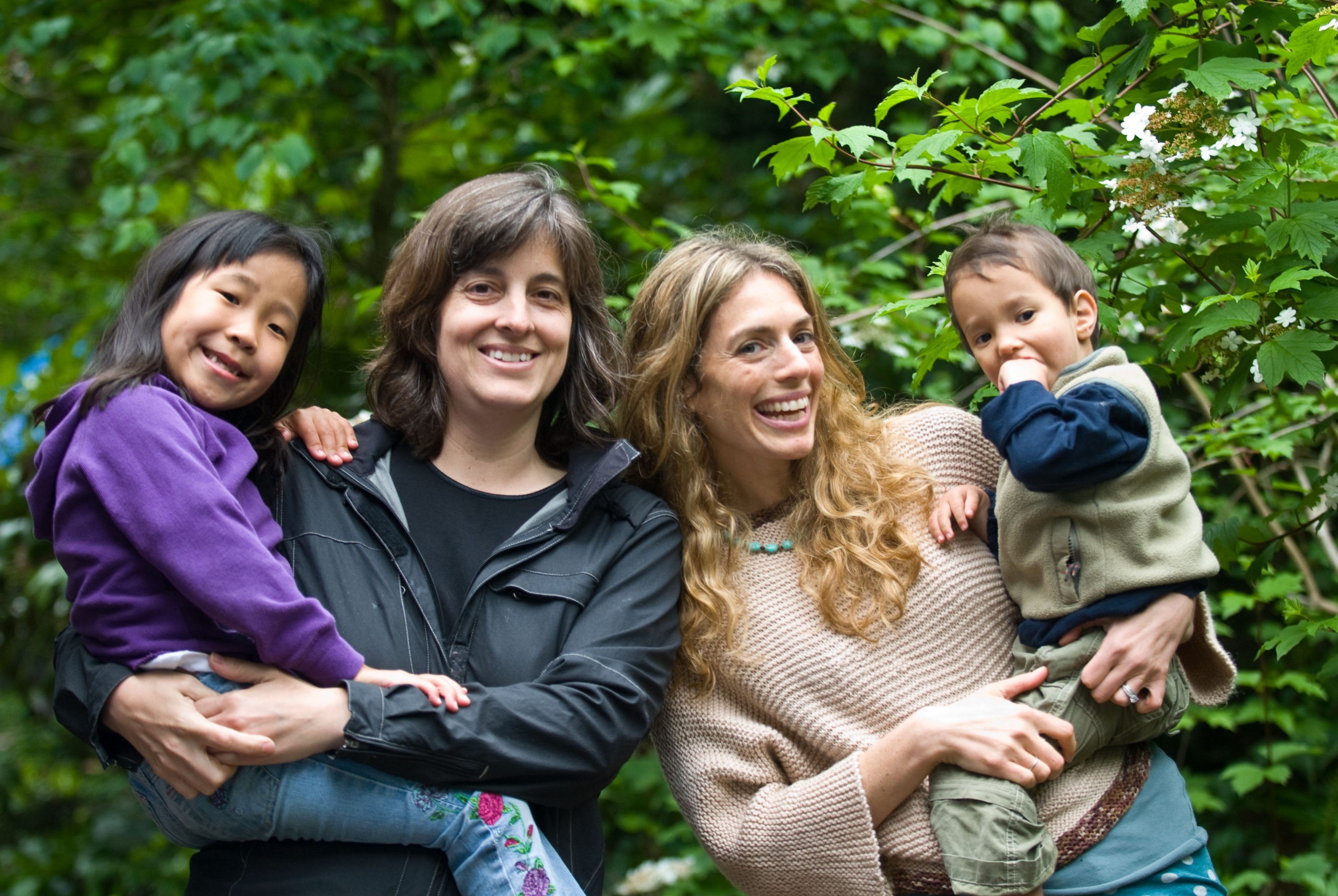 Mishelle Rudzinksi and Cindy Kaplan, SPOON's co-founders, holding their two children