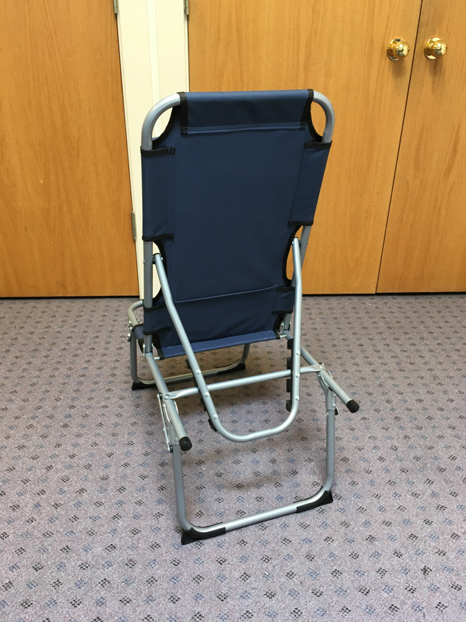 Prototype of the SPOON Chair from the back: a navy blue, aluminum folding chair