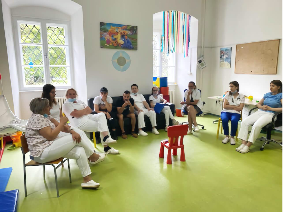 Training Session-Croatia-2 Group of ten trainees from Croatia sitting inside a daycare room in a circle